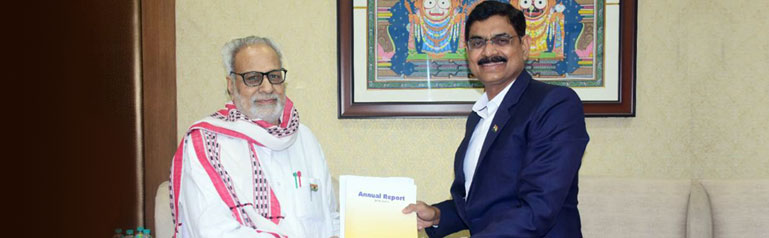 Dr S Mohanty, Chairman, presenting the Annual Report to Hon’ble Governor, Odisha